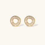 Gold-plated necklace and earring set with circular CZ crystal pendants featuring radial design on cream background