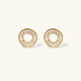 Gold-plated necklace and earring set with circular CZ crystal pendants featuring radial design on cream background