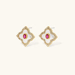 Gold-plated quatrefoil necklace and earring set with white enamel, pink cubic zirconia centers, and crystal borders
