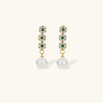 Gold-plated jewelry set with green cubic zirconia floral motifs, featuring matching necklace and pearl drop earrings
