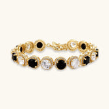Gold-plated jewelry set with alternating black and clear cubic zirconia stones, featuring necklace, earrings and bracelet