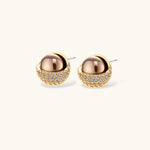 Elegant spherical pendant necklace and earrings set featuring crystal-pavé bottom half in gold or silver finish on white background.