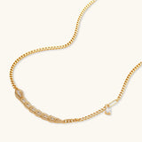 Gold-plated necklace with geometric diamond segments and matching huggie earrings featuring cubic zirconia details