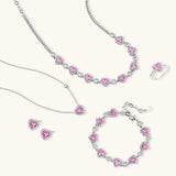 Pink heart-shaped cubic zirconia jewelry set with white gold plating featuring necklace, earrings, bracelet and ring