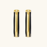 Modern hoop earrings with gold-plated and black sections, featuring hinged closure on white background.