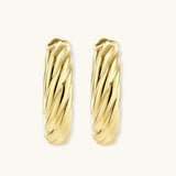 14K gold-plated twisted rope huggie hoop earrings with hinged closure on white background, showing textured surface detail