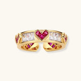 Gold-plated adjustable ring with alternating red heart-shaped and clear rectangular zirconia stones in geometric pattern