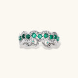 Platinum-plated copper ring with green zirconia stones in decorative scalloped wave pattern, adjustable band design.