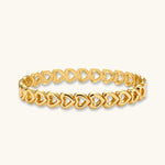 Gold 18K plated stainless steel bangle with continuous open heart links, high-polish finish, on white background.