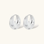 Silver-plated hoop earrings with star cutout designs, shown open and closed on white background, 17mm diameter.